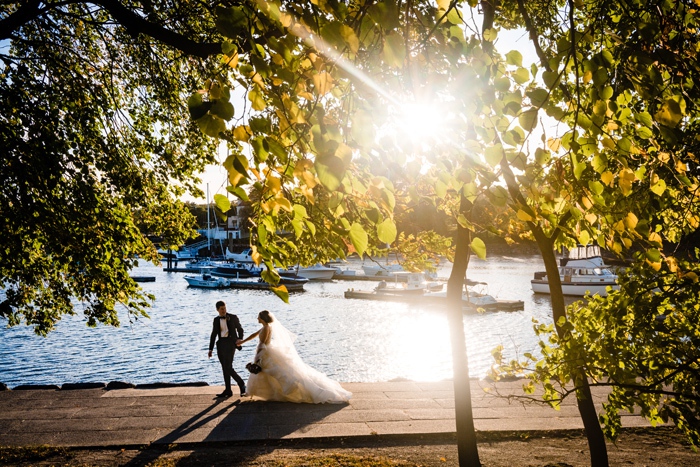 Bride and Groom walking by water