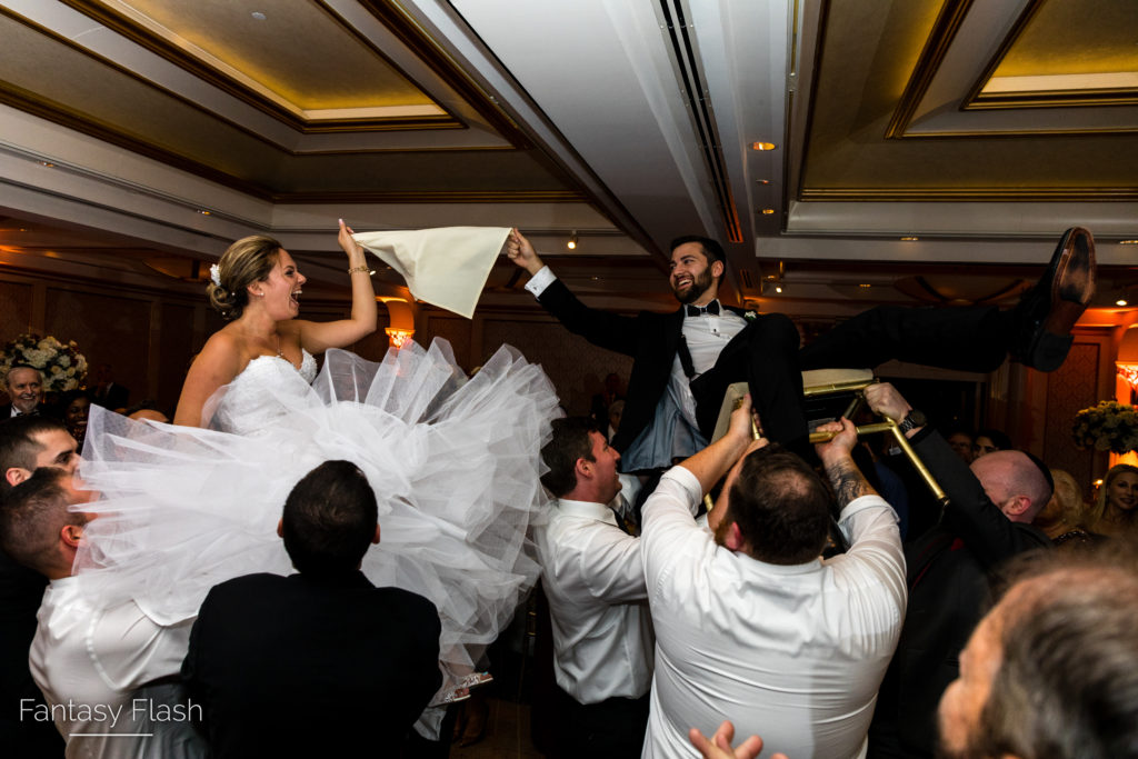 Wedding Photography of Bride and Groom doing Hora. Glen Island Harbor Club in New Rochelle, NY.