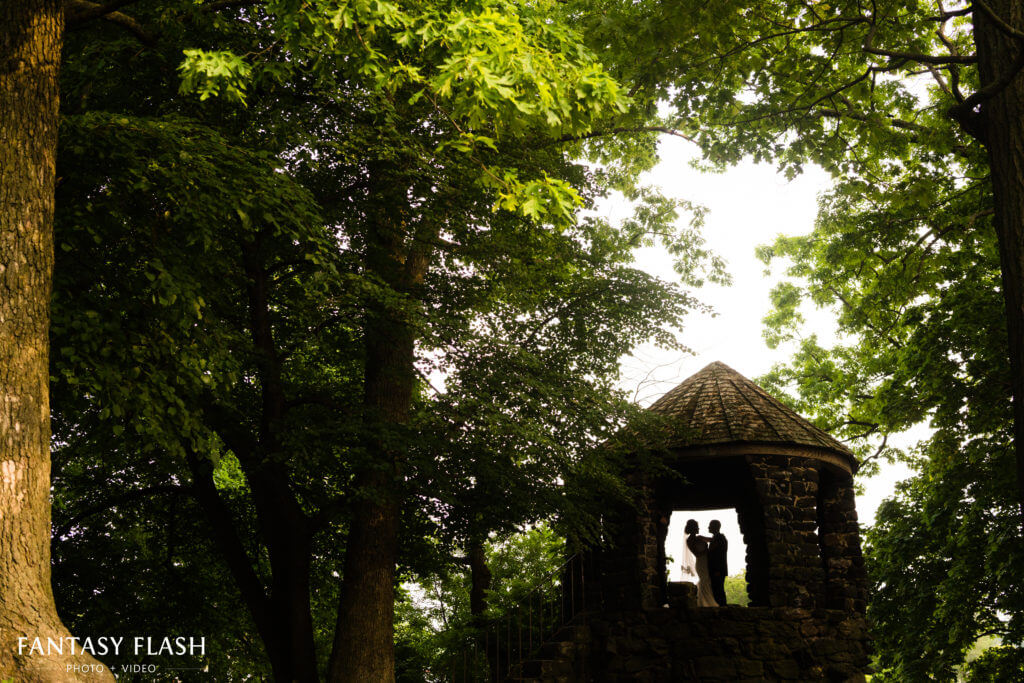 Wedding photo of bride and groom in stone castle at glen island park