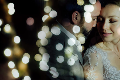 bride and groom posing for wedding portrait