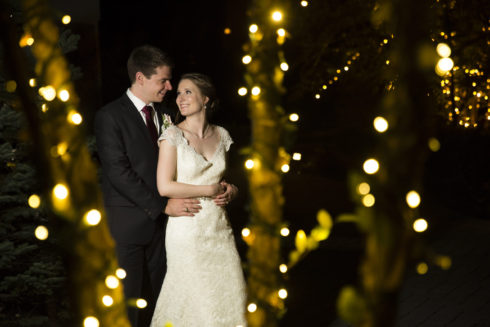 wedding portrait with Christmas tree lights