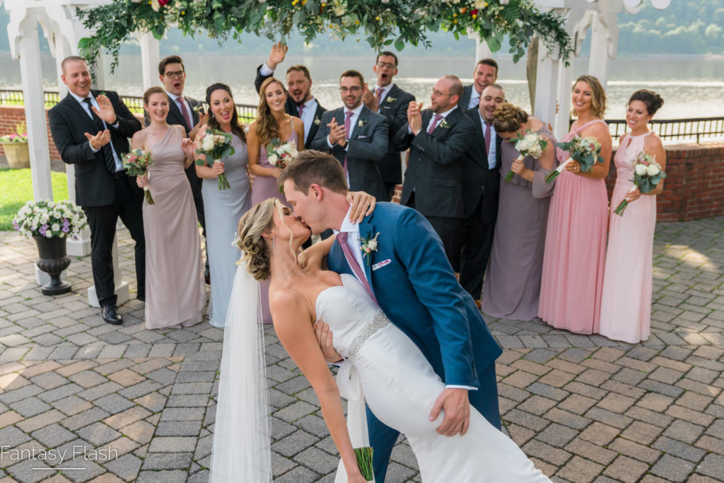 A bride and groom kissing for a wedding photo at The Grandview