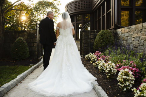 bride getting ready to walk down isle with her father