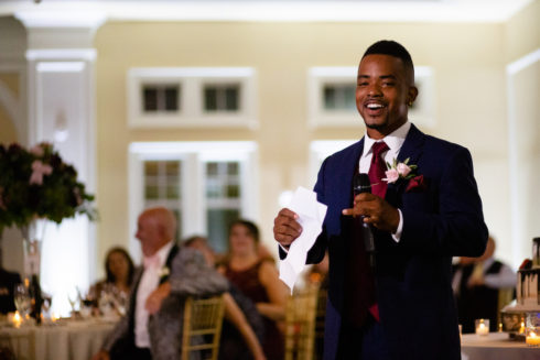 best man toasting bride and groom