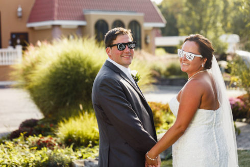 Bride and Groom wearing Bride and Groom sunglasses