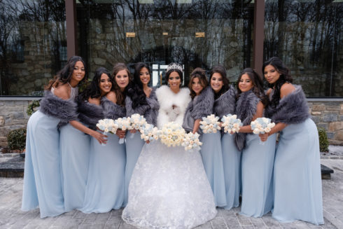 bride together with her bridesmaids posing for wedding pictures