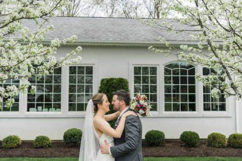 bride and groom posing for wedding portrait at Candlewood Inn