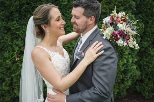 a candid shot of a bride and groom