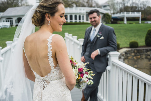 Bride and groom hanging out on the dock at Candlewood Inn