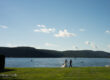 a bride and groom walking by lake Candlewood