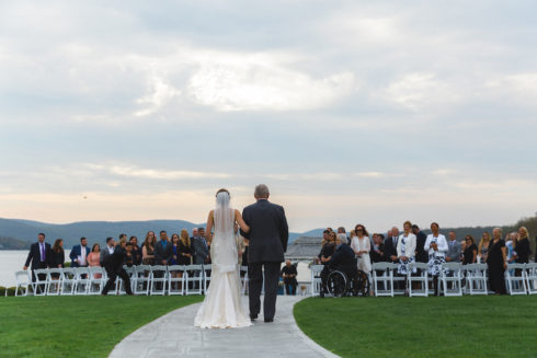 Bride and father walking down isle at the Candlewood inn