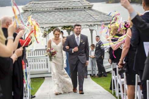 Newlyweds walking down the isle