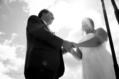 bride and groom holding hands