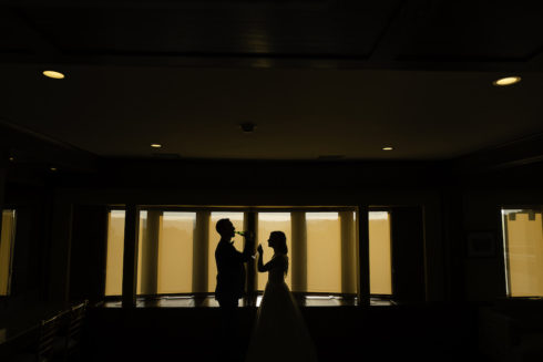 a bride and groom having a drink