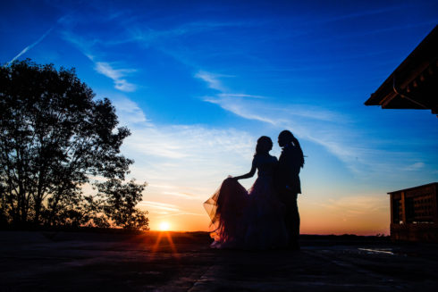sunset silhouette of a bride and a groom