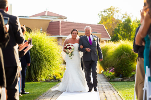 bride and father walking down the isle - outdoor wedding ceremony at Villa Borghese