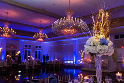 le chateau's ballroom fully decorated and uplight