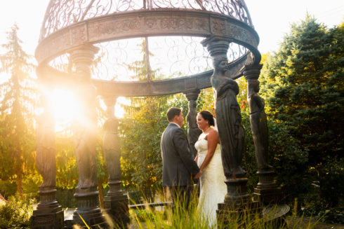 Bride and groom under a gazebo