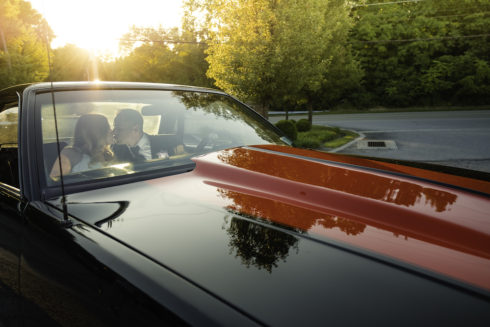 bride and groom in their car