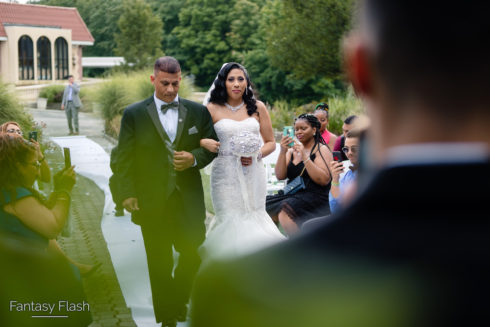 bride and father walking down the isle