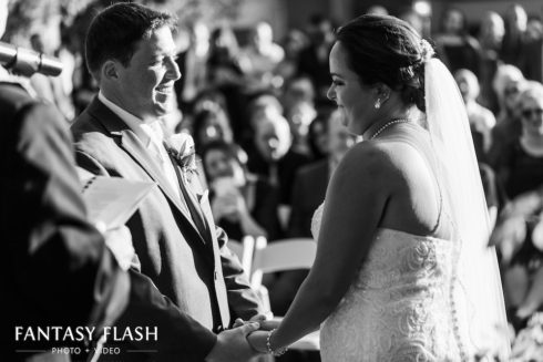 bride and groom holding hands