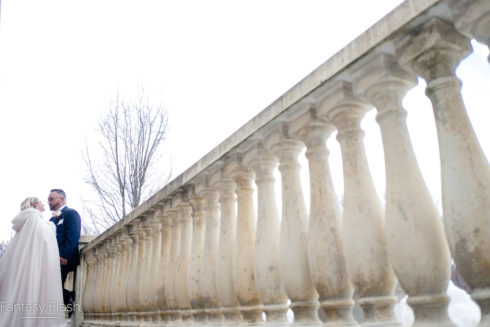 Bride and groom on patio at villa borghese
