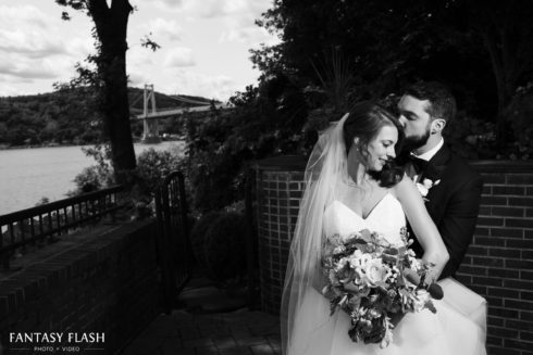 Black and White of groom holding bride
