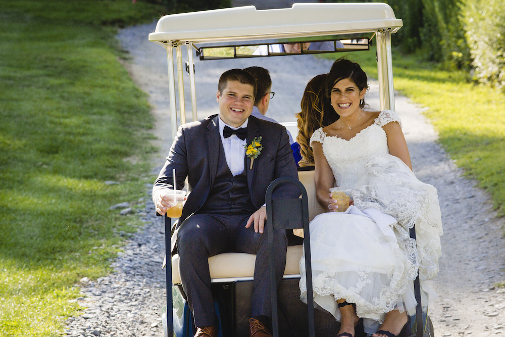 bride and groom on back of golf cart at Hollow Brook Golf Club