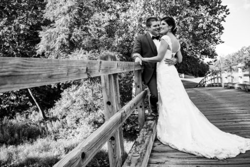 bride and groom on bridge at Hollow Brook Golf Club