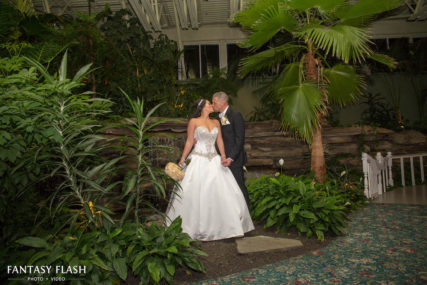 a bride and groom in the garden room at Anthonys Pier 9