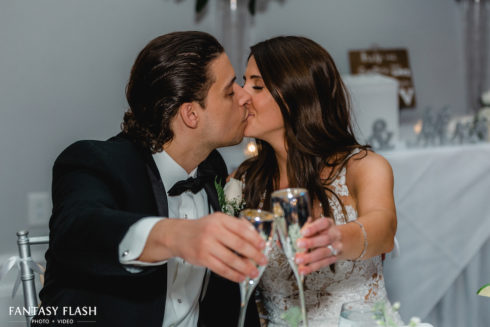 Bride and Groom toasting at New York Country Club