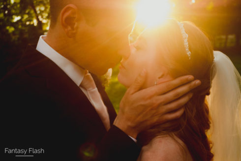 a bride and groom kissing