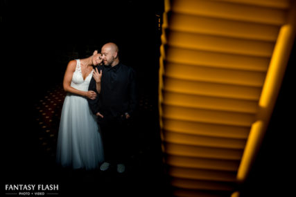 A bride and groom taking candid wedding photo