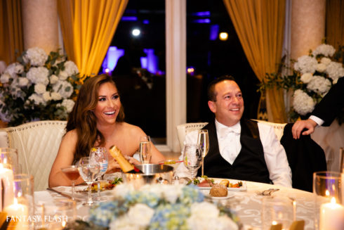 A bride and groom sitting at the dais