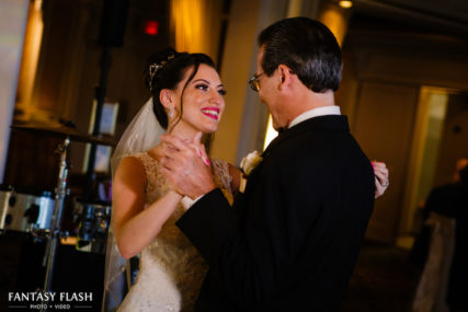 A bride dancing with her father at VIP Country Club