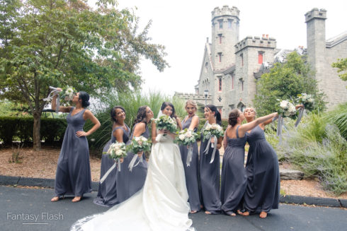 Bridesmaids posing in front of Whitby Castle